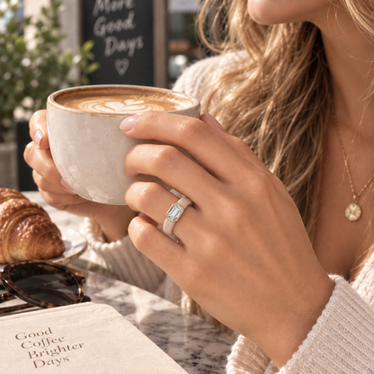 0.5ct Emerald Cut Lab-Grown Diamond Silicone Ring Worn on Hand with Coffee - Real Life Fit